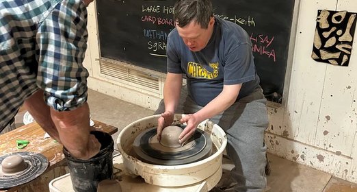 Robert, a Lightspire artist, working on a creative project in the studio